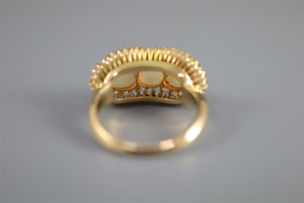 A gold, three stone white opal and diamond set cluster ring,